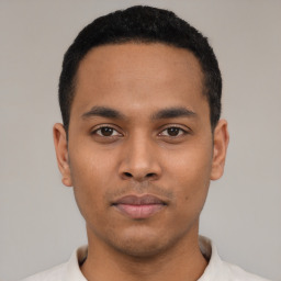 Neutral latino young-adult male with short  black hair and brown eyes