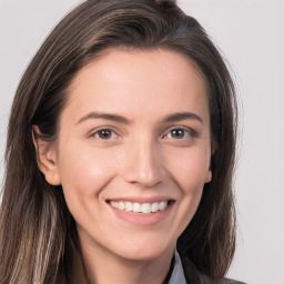 Joyful white young-adult female with long  brown hair and grey eyes