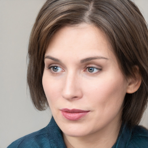 Neutral white young-adult female with medium  brown hair and grey eyes