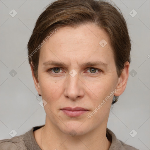 Joyful white adult female with short  brown hair and grey eyes