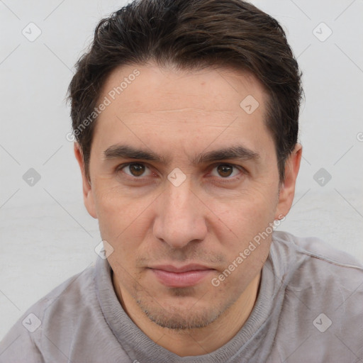 Joyful white adult male with short  brown hair and brown eyes