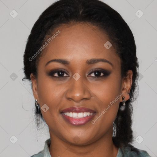 Joyful black young-adult female with long  brown hair and brown eyes