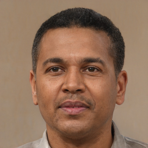 Neutral latino adult male with short  black hair and brown eyes