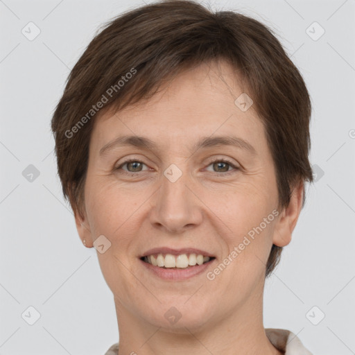 Joyful white adult female with short  brown hair and brown eyes