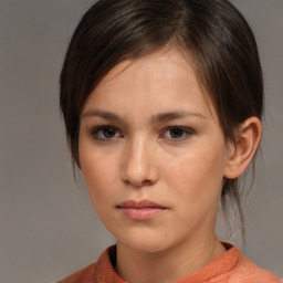 Neutral white young-adult female with medium  brown hair and brown eyes