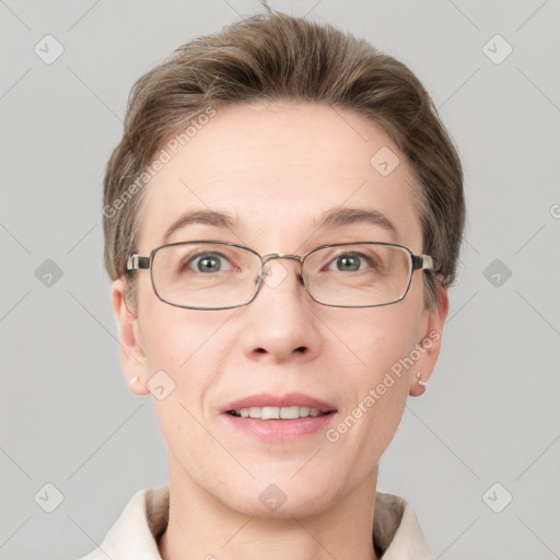 Joyful white adult female with short  brown hair and grey eyes