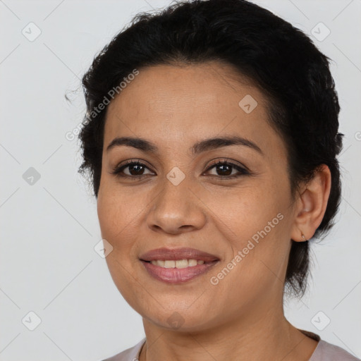 Joyful latino young-adult female with short  brown hair and brown eyes