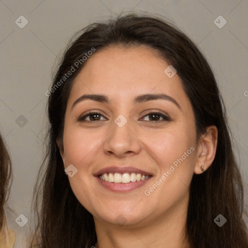 Joyful white young-adult female with long  brown hair and brown eyes