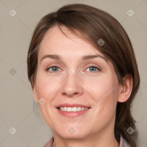 Joyful white young-adult female with medium  brown hair and grey eyes