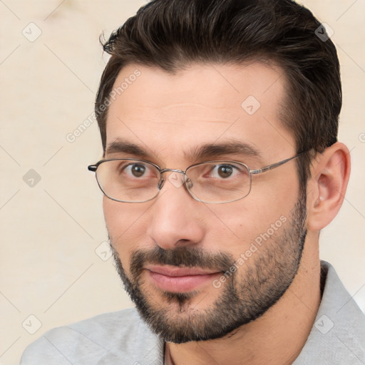 Joyful white adult male with short  brown hair and brown eyes