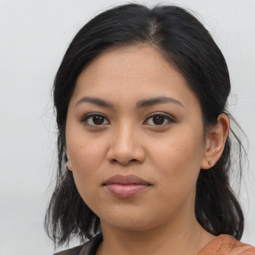 Joyful asian young-adult female with medium  brown hair and brown eyes