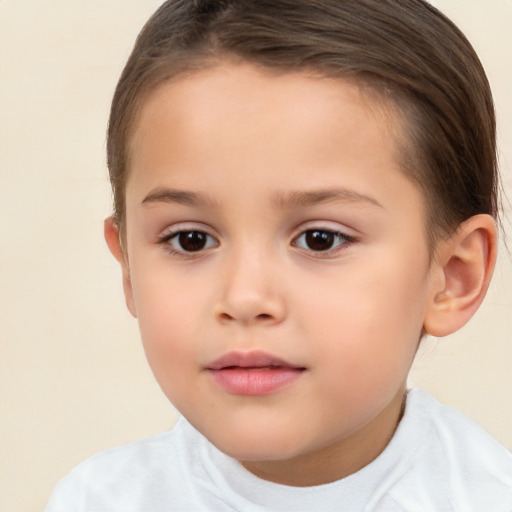 Joyful white child female with short  brown hair and brown eyes