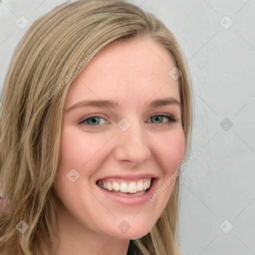 Joyful white young-adult female with long  brown hair and blue eyes