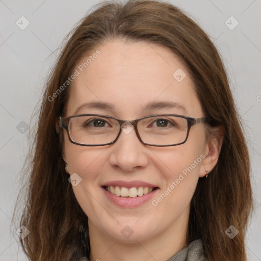 Joyful white adult female with long  brown hair and grey eyes