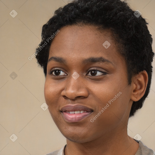 Joyful black young-adult female with short  black hair and brown eyes