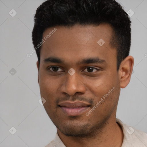 Joyful latino young-adult male with short  black hair and brown eyes