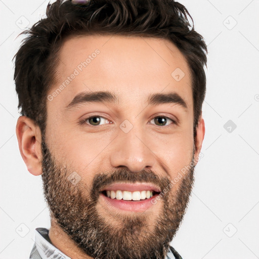 Joyful white young-adult male with short  black hair and brown eyes