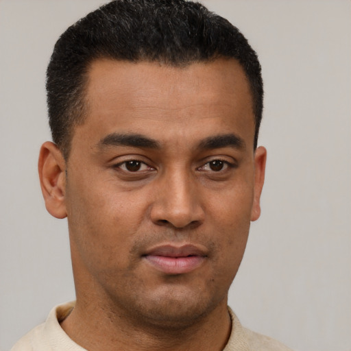Neutral latino young-adult male with short  black hair and brown eyes