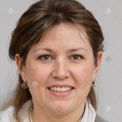 Joyful white adult female with medium  brown hair and grey eyes