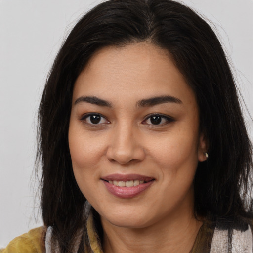 Joyful asian young-adult female with medium  brown hair and brown eyes