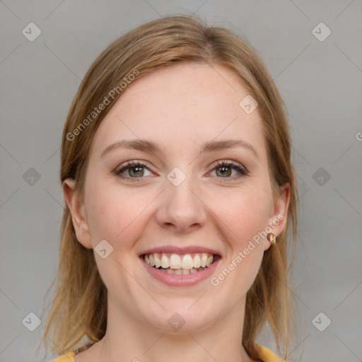 Joyful white young-adult female with medium  brown hair and blue eyes