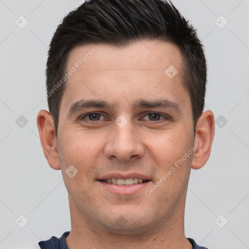 Joyful white young-adult male with short  brown hair and brown eyes