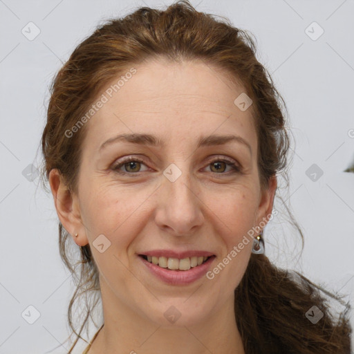 Joyful white adult female with long  brown hair and brown eyes