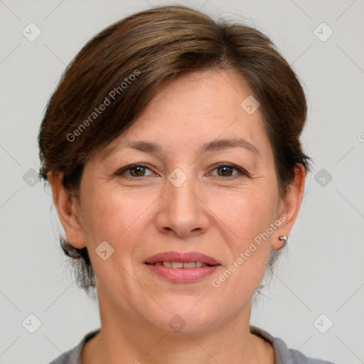 Joyful white adult female with medium  brown hair and grey eyes