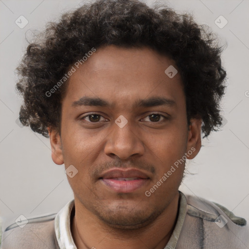 Joyful black young-adult male with short  brown hair and brown eyes