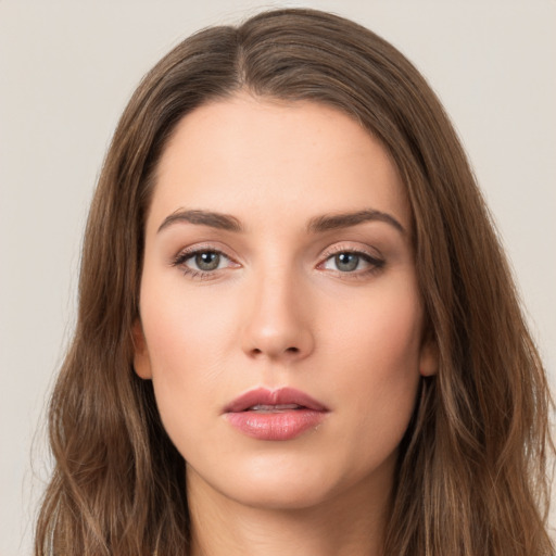 Neutral white young-adult female with long  brown hair and brown eyes