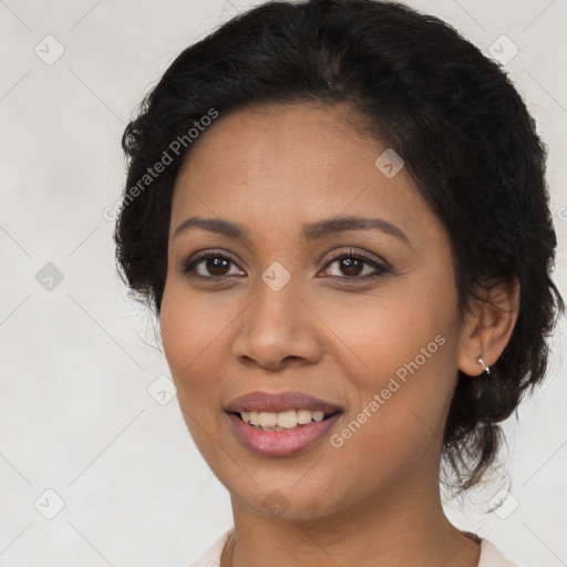 Joyful latino young-adult female with long  brown hair and brown eyes