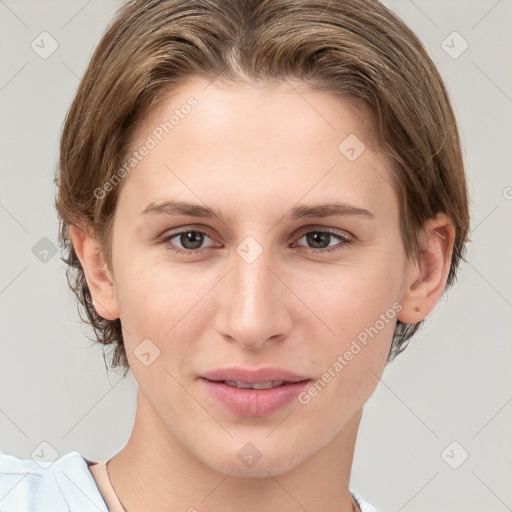 Joyful white young-adult female with medium  brown hair and brown eyes