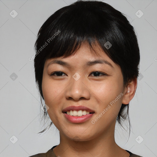 Joyful asian young-adult female with medium  black hair and brown eyes