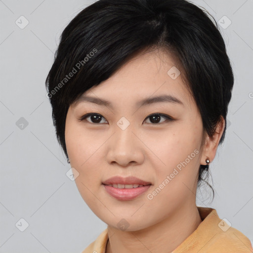 Joyful asian young-adult female with medium  black hair and brown eyes