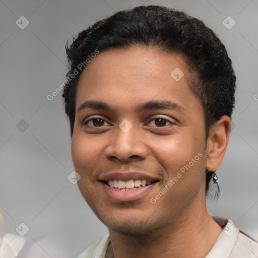 Joyful latino young-adult male with short  brown hair and brown eyes