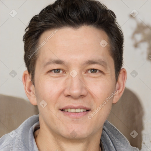 Joyful white adult male with short  brown hair and brown eyes