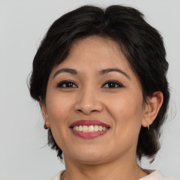 Joyful white young-adult female with medium  brown hair and brown eyes