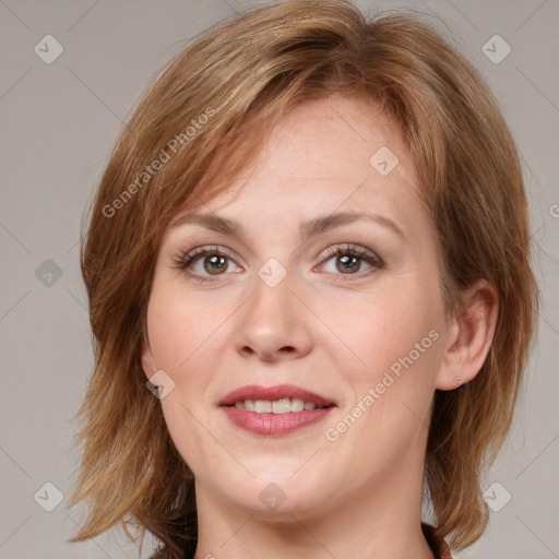 Joyful white young-adult female with medium  brown hair and blue eyes