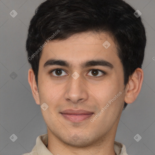 Joyful latino young-adult male with short  brown hair and brown eyes