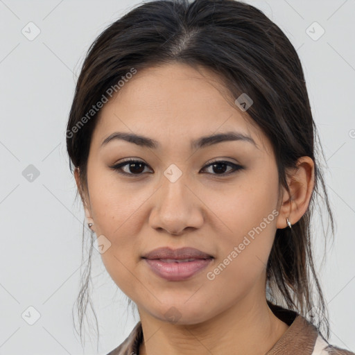 Joyful latino young-adult female with medium  brown hair and brown eyes