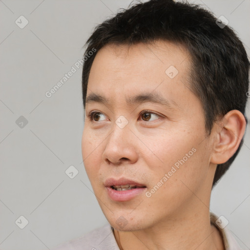 Neutral white adult male with short  black hair and brown eyes