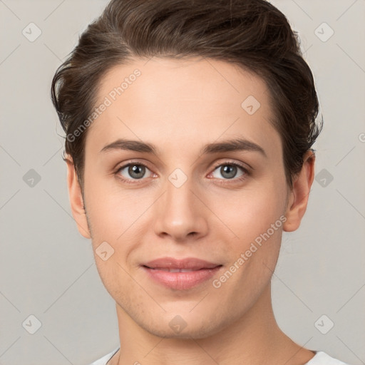 Joyful white young-adult female with short  brown hair and brown eyes