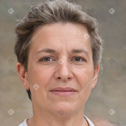 Joyful white adult female with short  brown hair and grey eyes