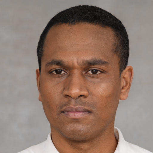 Neutral black young-adult male with short  black hair and brown eyes