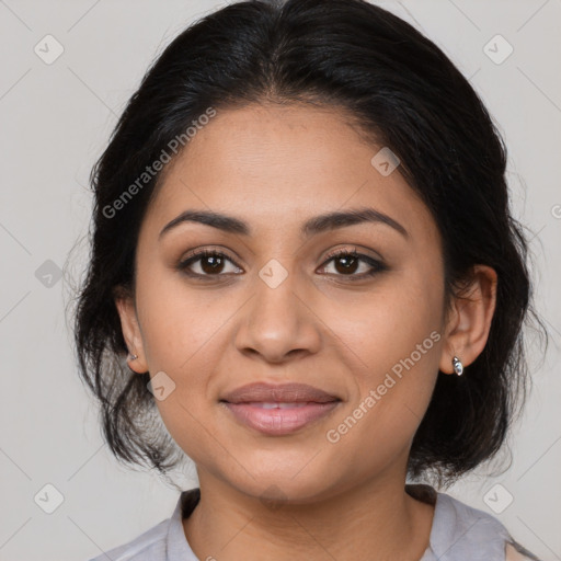 Joyful latino young-adult female with medium  brown hair and brown eyes