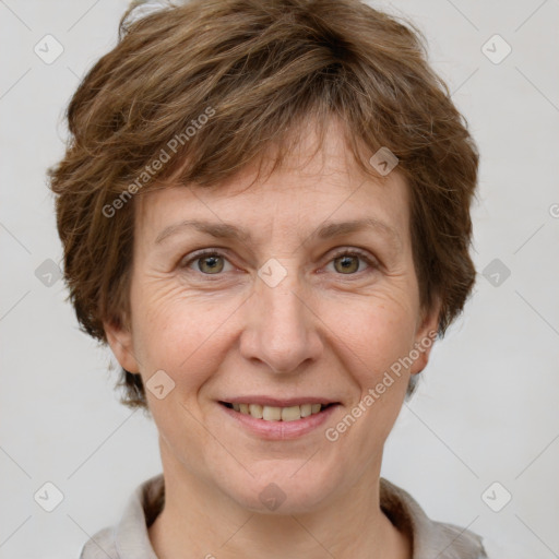 Joyful white adult female with short  brown hair and grey eyes