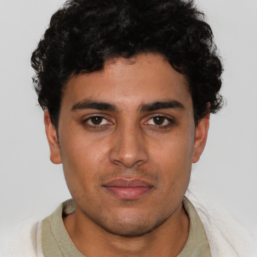 Neutral latino young-adult male with short  brown hair and brown eyes