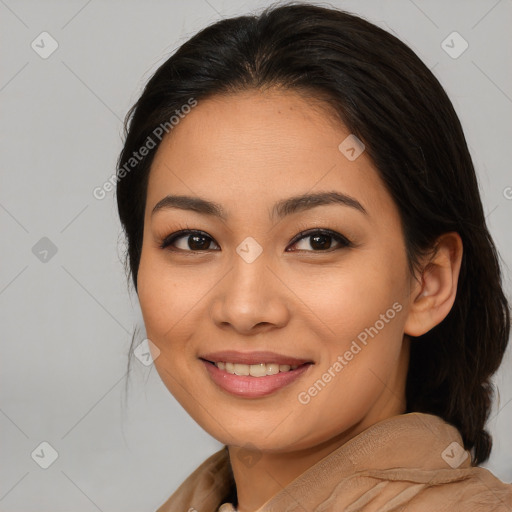 Joyful asian young-adult female with long  brown hair and brown eyes