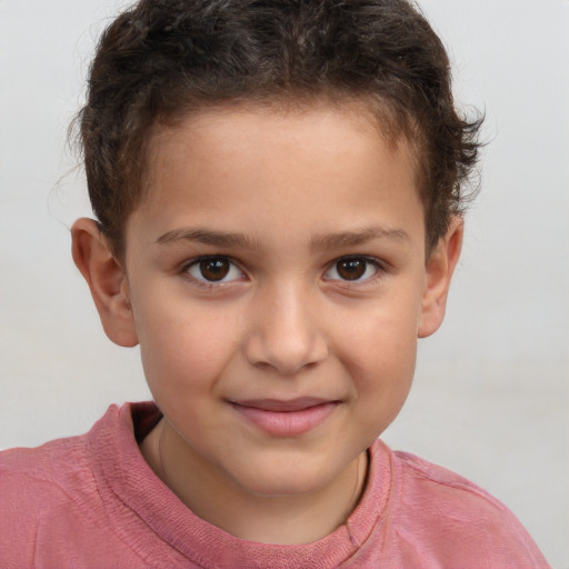 Joyful white child male with short  brown hair and brown eyes