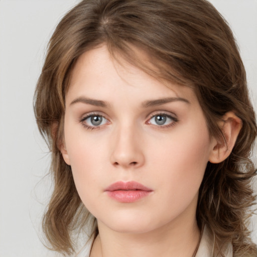 Neutral white young-adult female with medium  brown hair and grey eyes